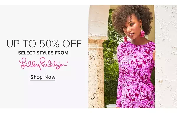 Image of a woman in a floral bright pink dress. Up to 50% off select styles from Lilly Pulitzer.