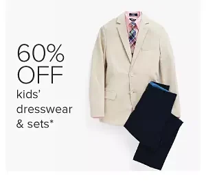 A beige boys suit jacket and black pants. 60% off kids' dresswear and sets.