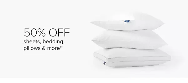 Folded quilts and a pillow. 50% off sheets, bedding, pillows and more.