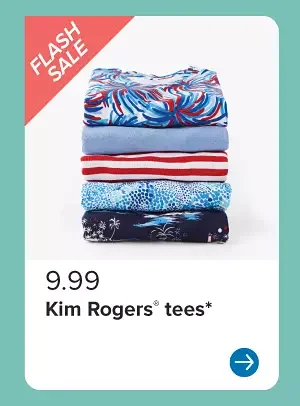 A stack of red, white and blue women's shirts. 9.99 Kim Rogers tees.