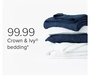 A stack of blue and white folded bedding. 99.99 Crown and Ivy bedding.