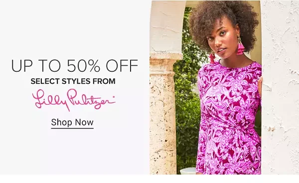 Image of a woman in a floral bright pink dress. Up to 50% off select styles from Lilly Pulitzer.