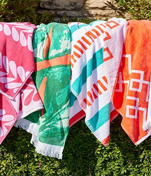 Southern Living • Outdoor Living Collection Geo Chevron Border Jacquard Beach Towel • Outdoor Living Collection Multicolored Stripe Jacquard Beach Towel • Outdoor Living Collection Monstera Printed Beach Towel • Outdoor Living Collection Diamond Beach Towel • SHOP NOW