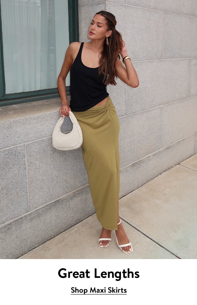 A woman wearing a maxi skirt.