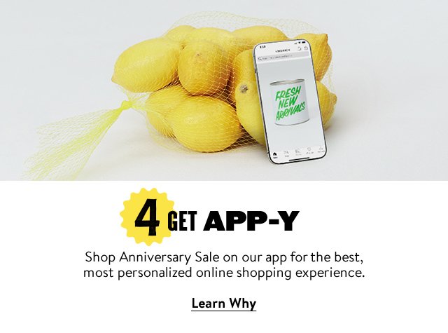 A phone open to the Nordstrom app and set against a bag of lemons.