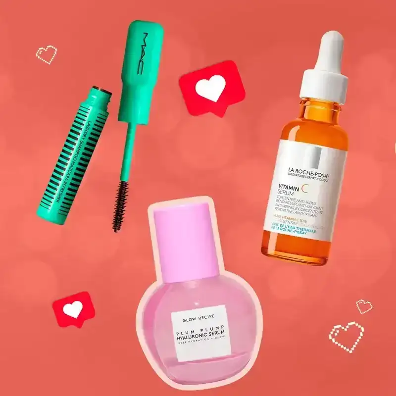 Readers' Favorite Products of 2023: a collage of MAC, Glow Recipe, La Roche-Posay, Chanel, and Peripera beauty products on a red background with heart emojis