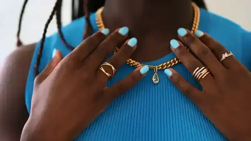 Black girl with turquoise nails 