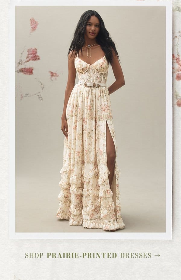 Woman in floral prairie dress. Shop prairie printed dresses