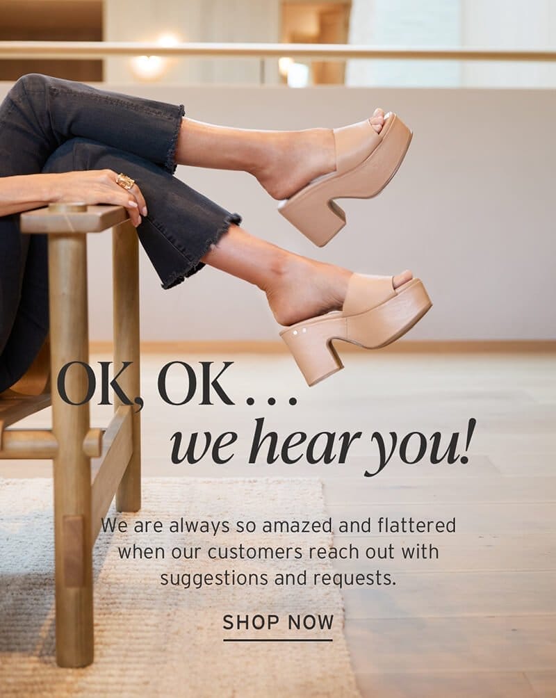 Model in black denim on chair wearing leather wrapped heels