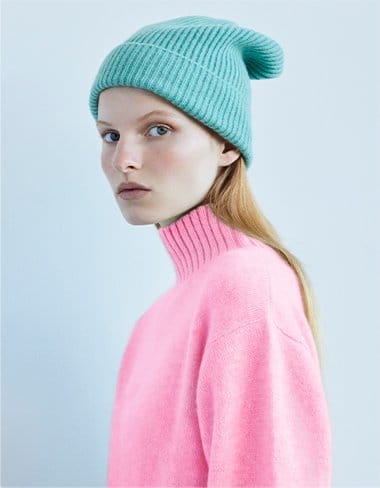 Model wearing The Elder Statesman Parker Ribbed Beanie and High Neck Cashmere Sweater