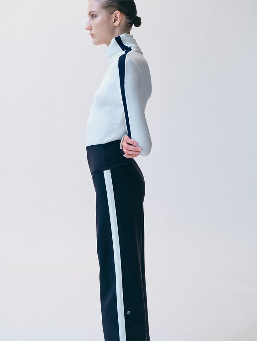 Model wears SPLITS59 - Jackson Rib-Knit Turtleneck Top and Harper Supplex Pant