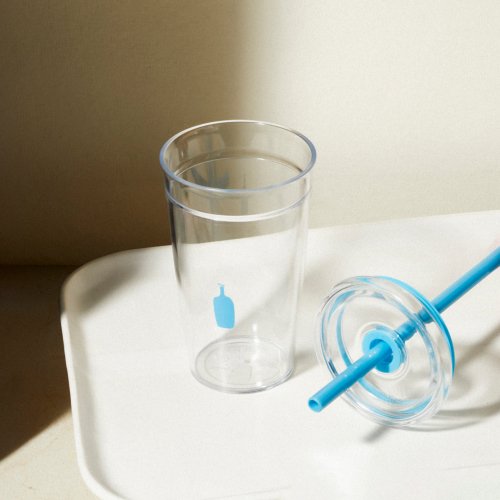 Image of the Clear Cold Tumbler with the lid removed and placed next to the tumbler.