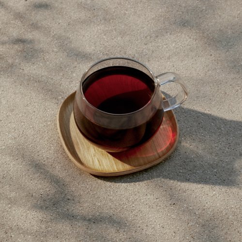 Image of brewed cup of coffee in glass mug.