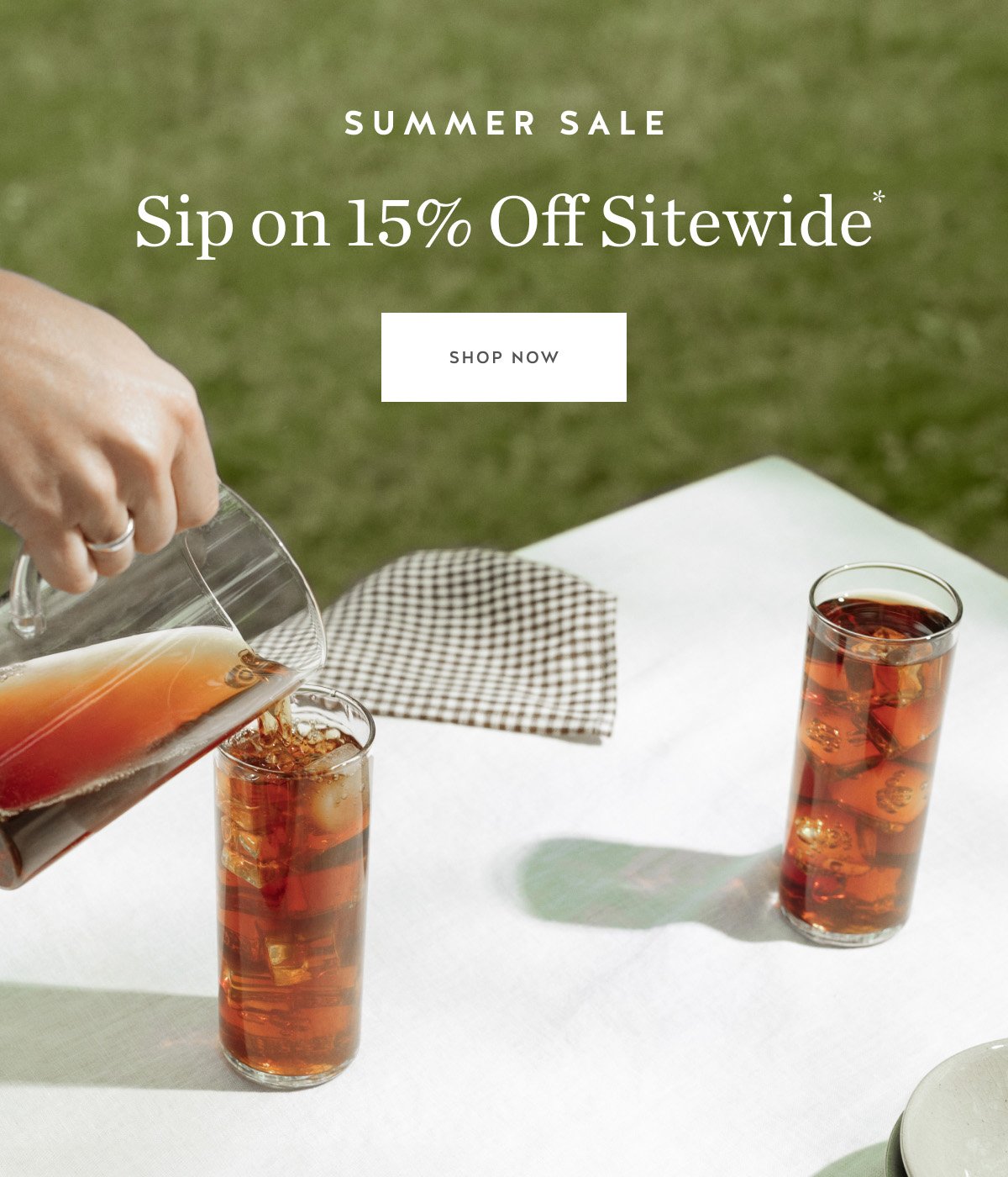 Image of brewed coffee on white table with the following text superimposed: Summer Sale Sip on 15% Off Sitewide*