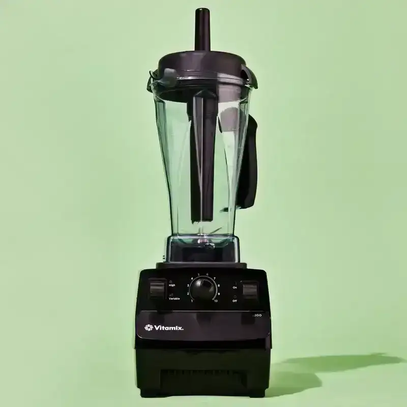 The Vitamix 5200—the best blender according to the Bon Appétit test kitchen—on a green background