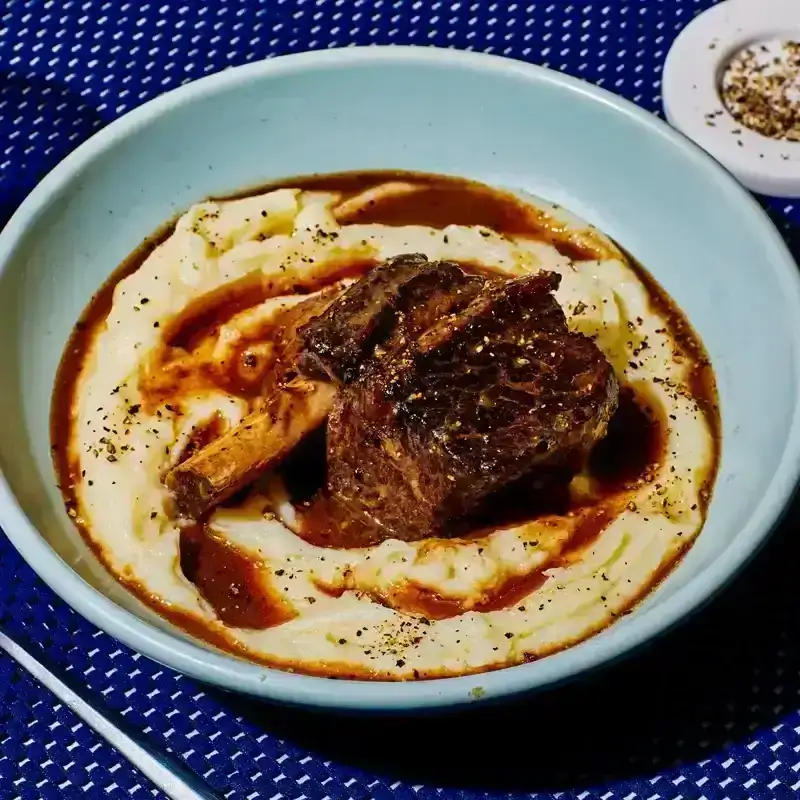 Coffee-and-Bourbon-Braised Short Ribs in a blue bowl