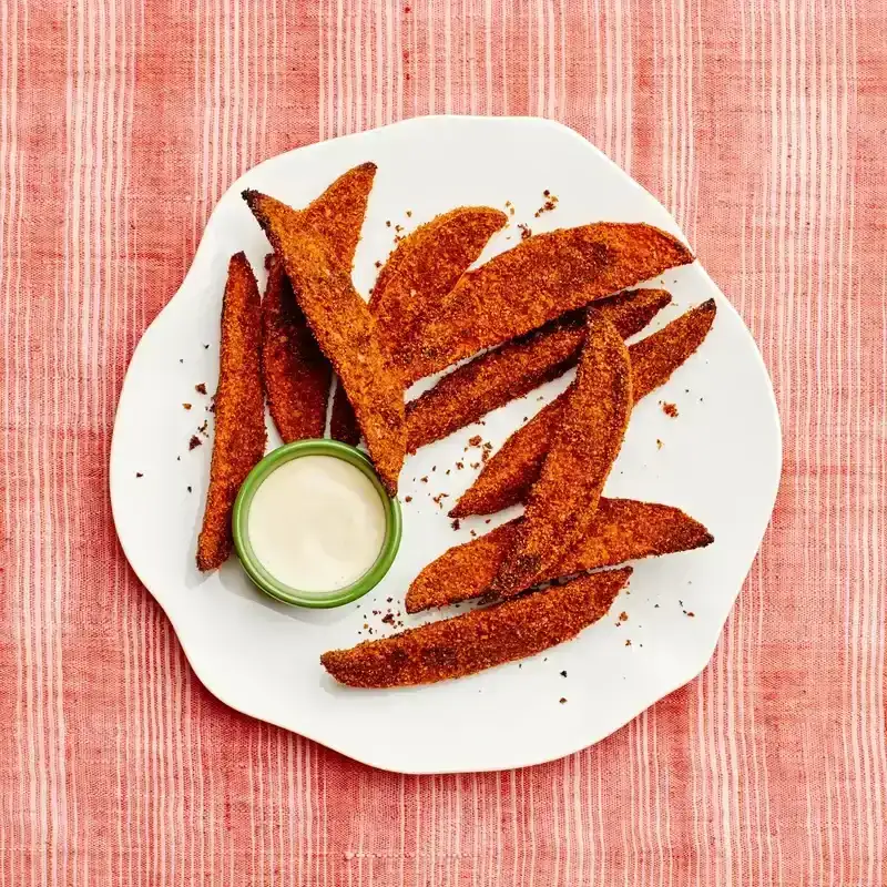 Cornmeal-Crusted Sweet Potato Wedges on a white organic shaped plate