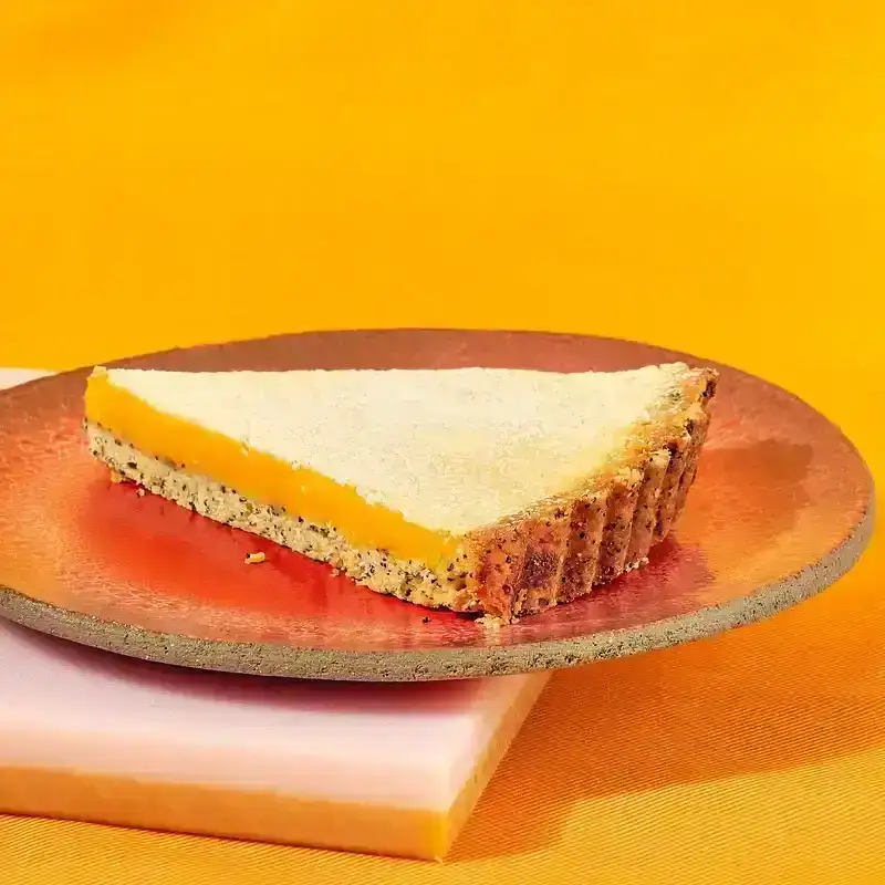 Slice of Lemon-Poppy Seed Tart on a plate