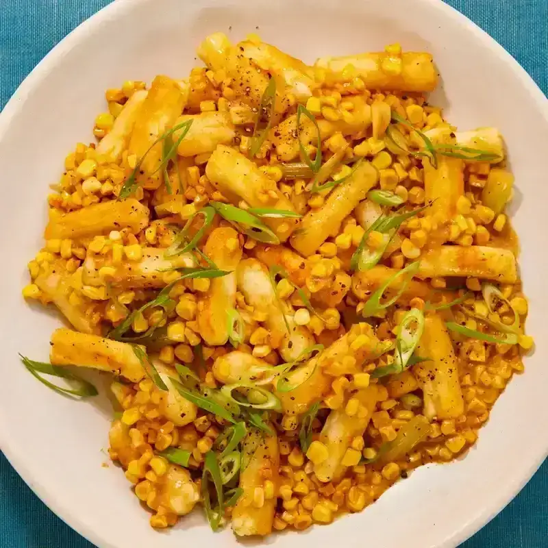 Rice cakes and corn on white plate