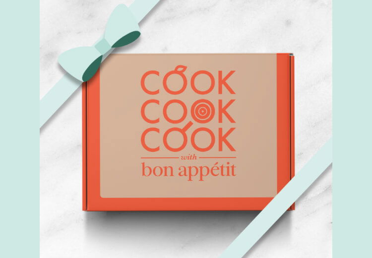 Cook with Bon Appétit box with a light blue ribbon around it.