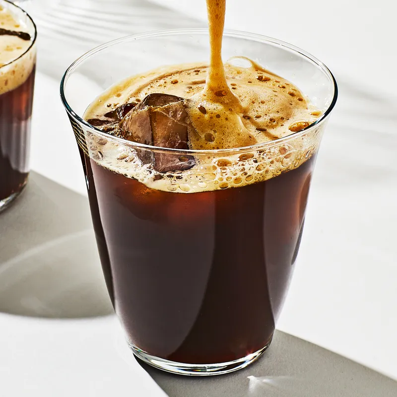 carajillo in a glass on a white surface 