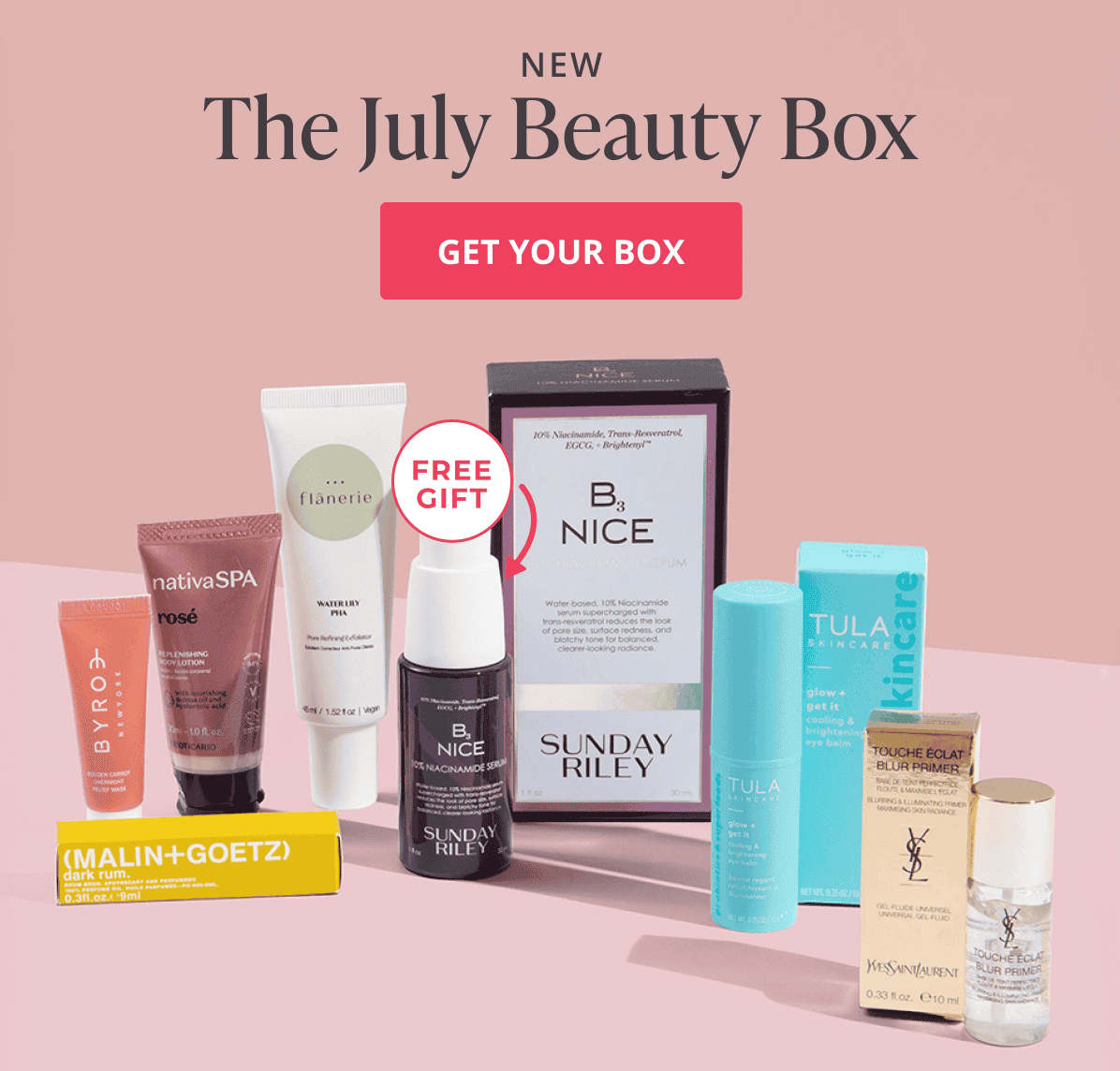 The new July beauty box. Get your box. A group shot displaying the featured Julu box products lined up next to eachother with a pink background.