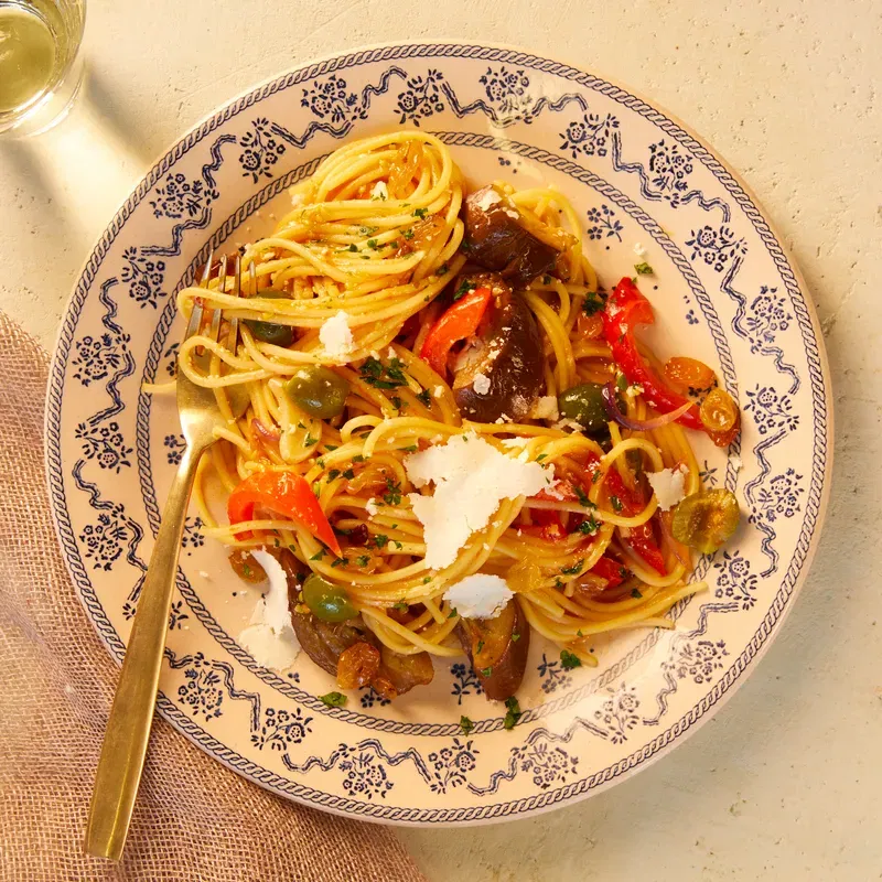 Spaghetti on white and blue plate