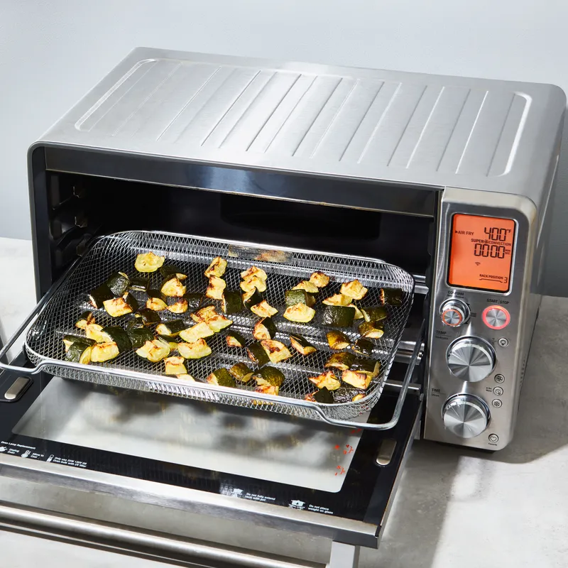 A Breville Joule Oven Air Fryer with roasted zucchini.