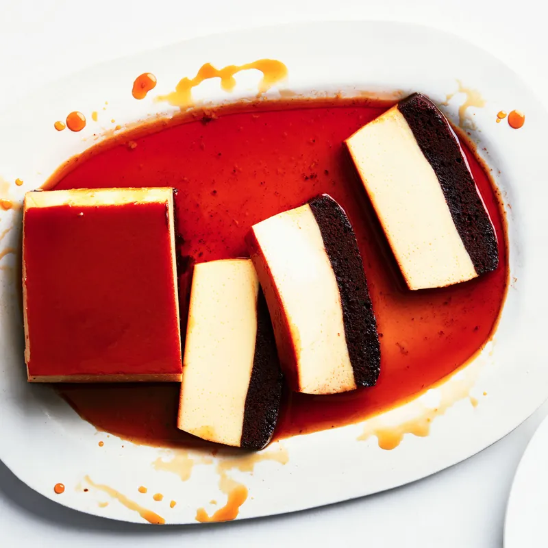 Chocoflan on a white plate on a white surface