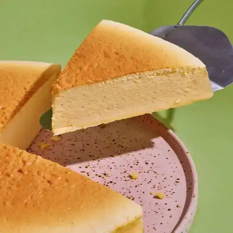 Japanese Cheesecake on a purple paint splattered plate 