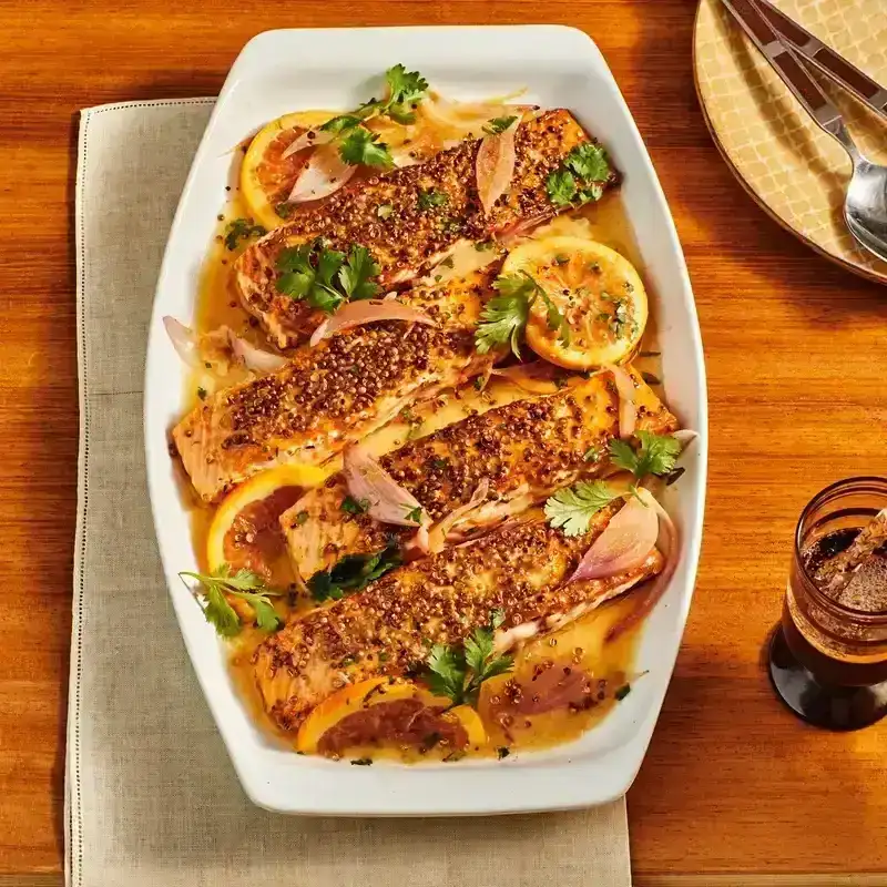 Salmon Filets on a white platter placed on a wood surface