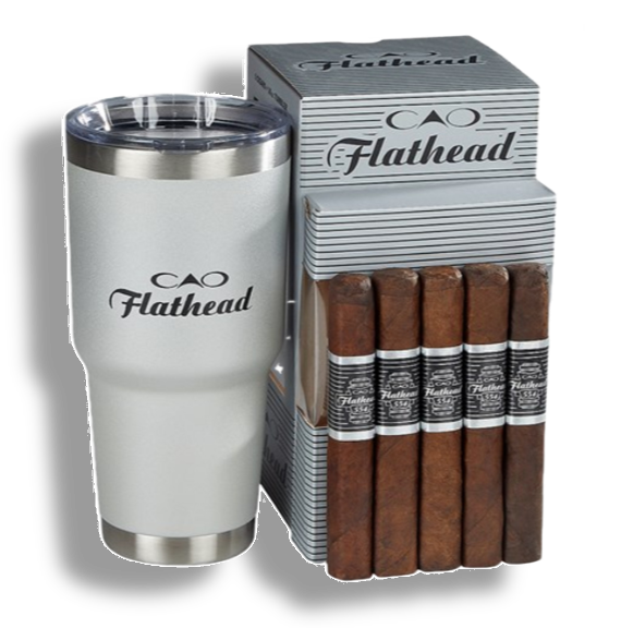 a box of cao flathead cigars next to a white tumbler