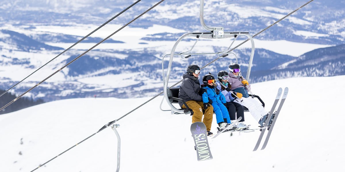 Family on a ski lift together