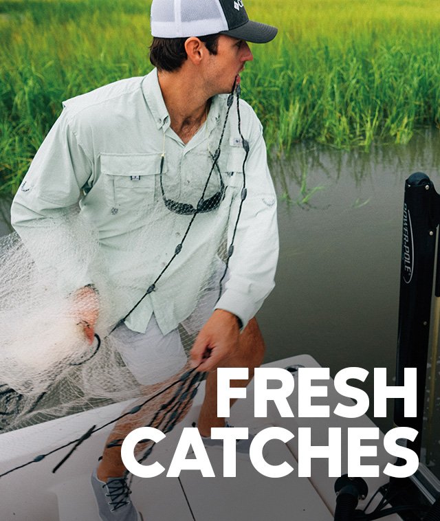 Fresh Catches. A man in Columbia fishing gear ready to toss a net 