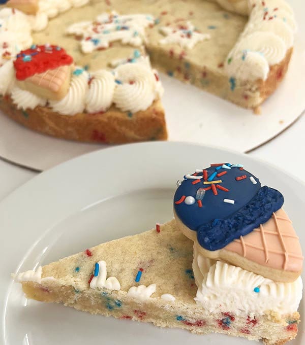 Slice of 4th of July cookie cake with decorative ice cream cone shaped cookies