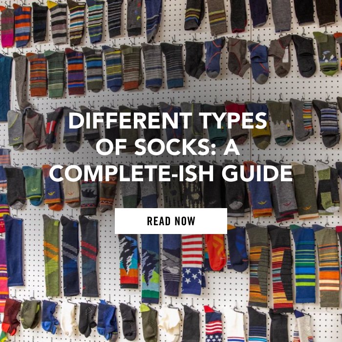 Read Different Types of Socks: A Complete-ish Guide - dozens of socks hanging on a white wall at the Mill