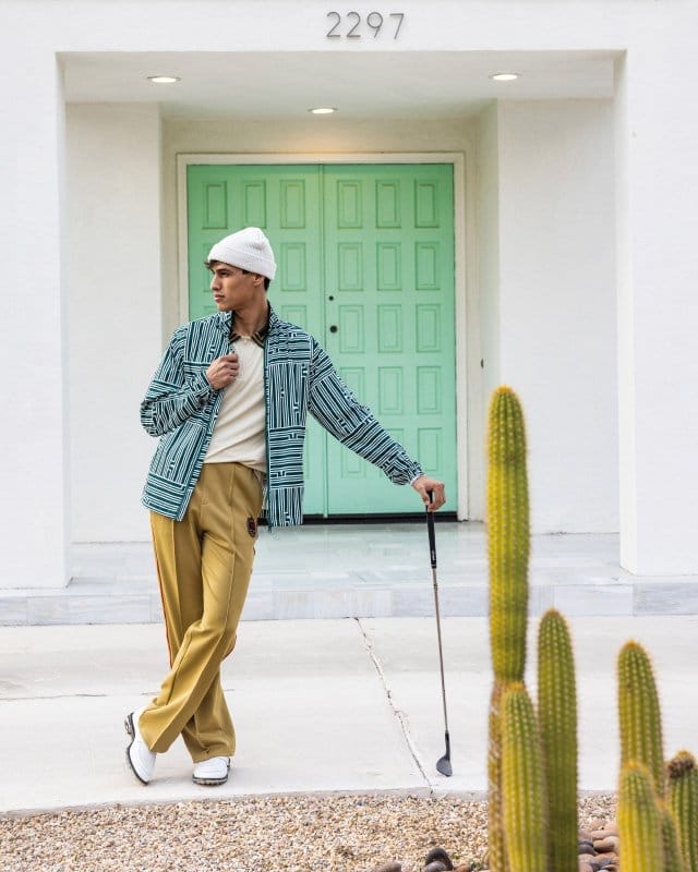 Man standing outside with golf club