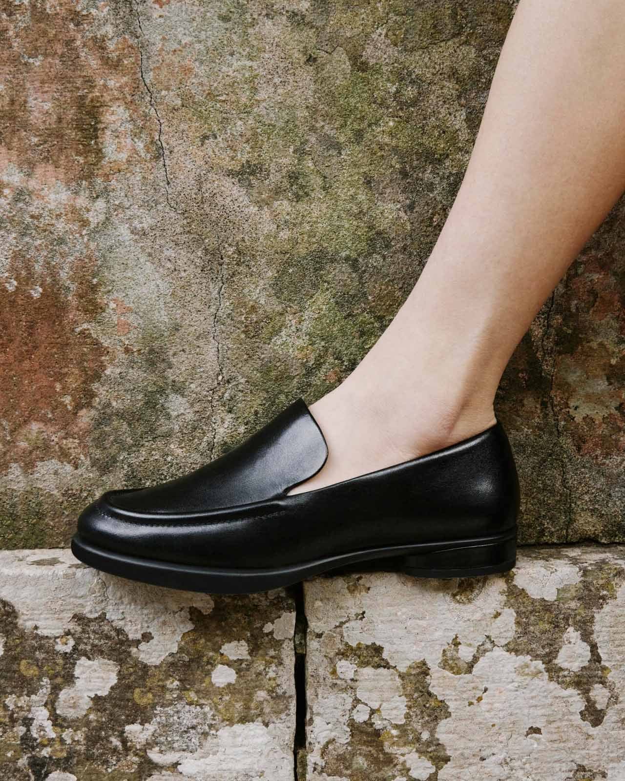 Model wearing black loafer