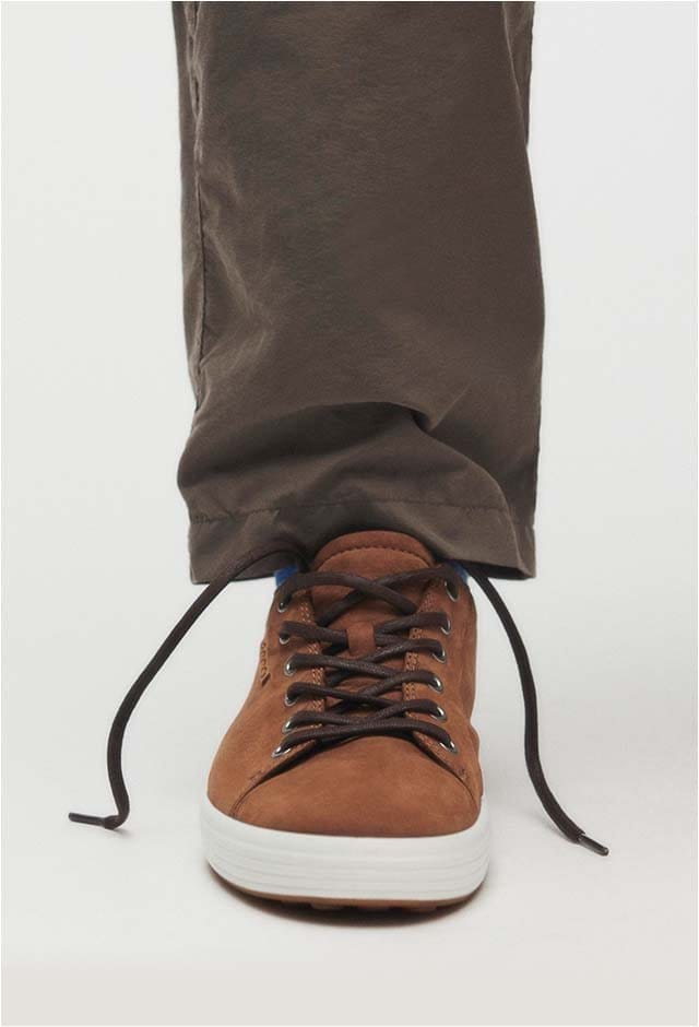 Man wearing brown casual sneaker