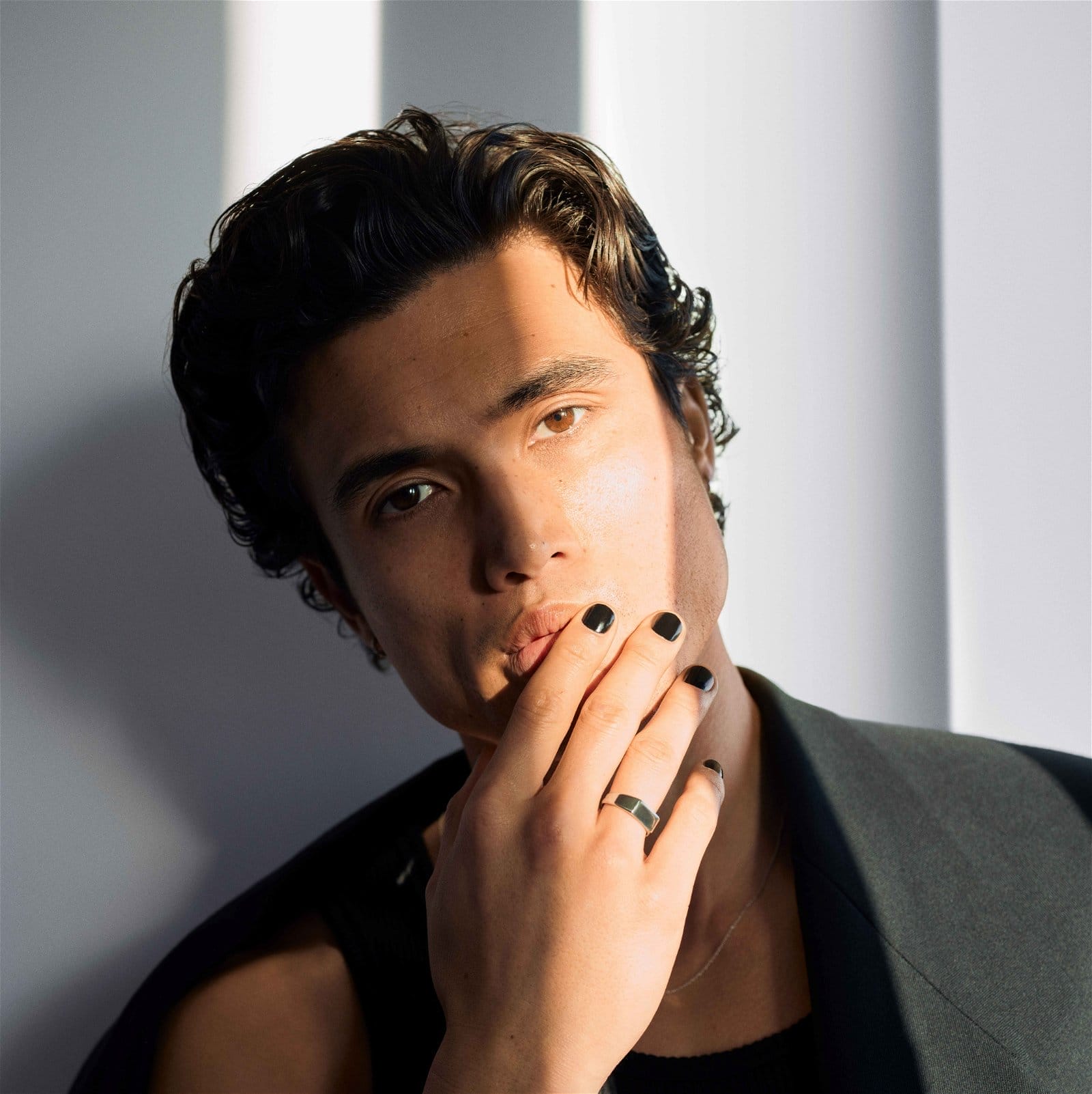 If there was one word to describe Charles Melton, it would be “grateful.” <br><br>When I first arrive at the undisclosed location in West Hollywood for our interview, the May December actor had been shooting his ad campaign for YSL Beauty—he’s the handsome new U.S. voice of the brand’s MYSLF cologne in the U.S.—since the early morning, and has a short break to grab something to eat before we talk. I surprise him with a handful of Asian snacks, ranging from rice crackers to chocolate sticks to a variety of Korean moon pies, which he quickly sifts through, picking the rice crackers to consume first. <br><br>“That’s so sweet,” Melton says, in the most charming way. “Thank you so much.” <br><br>Throughout our interview, the 33-year-old Korean American actor continues to express this gratitude for everything in his life.