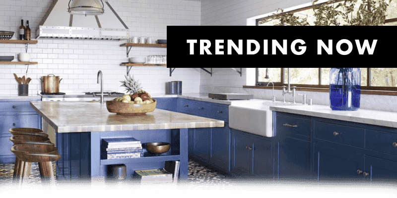 TRENDING NOW of an image of a new kitchen with blue cabinets, white tile backsplash and silver fixtures