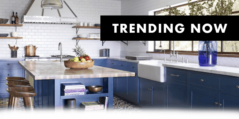 TRENDING NOW of an image of a new kitchen with blue cabinets, white tile backsplash and silver fixtures