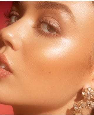 Model wearing Halo Glow Liquid Filter on high points of face