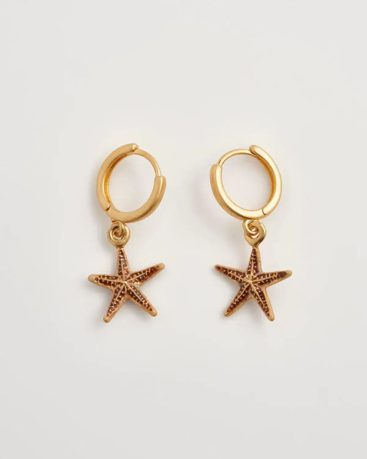 Image of Starfish Worn Gold Huggie Hoops