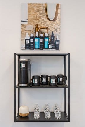 A photo poster and promo products with customized labels are on display in a business.