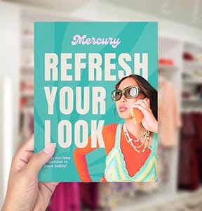 A hand holds a flyer that reads “REFRESH YOUR LOOK.”