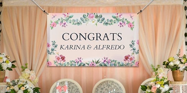 An indoor banner is displayed at a wedding venue.