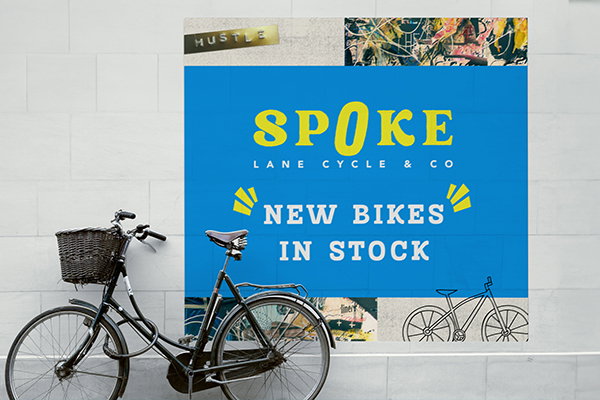 A blue wall graphic for a bicycle shop reads “NEW BIKES IN STOCK.”