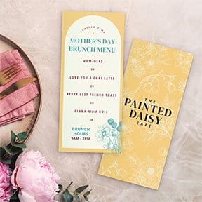 Two menus sit on a table featuring a “MOTHER’S DAY BRUNCH MENU.”