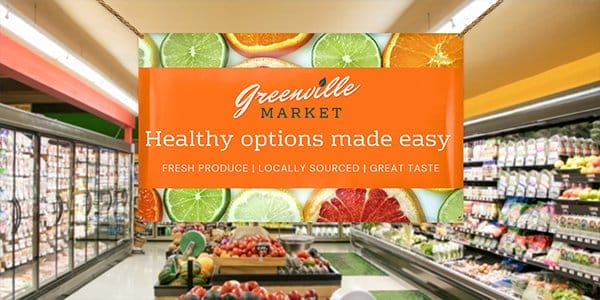 An indoor banner hangs inside Greenville Market informing customers of “healthy options made easy.”